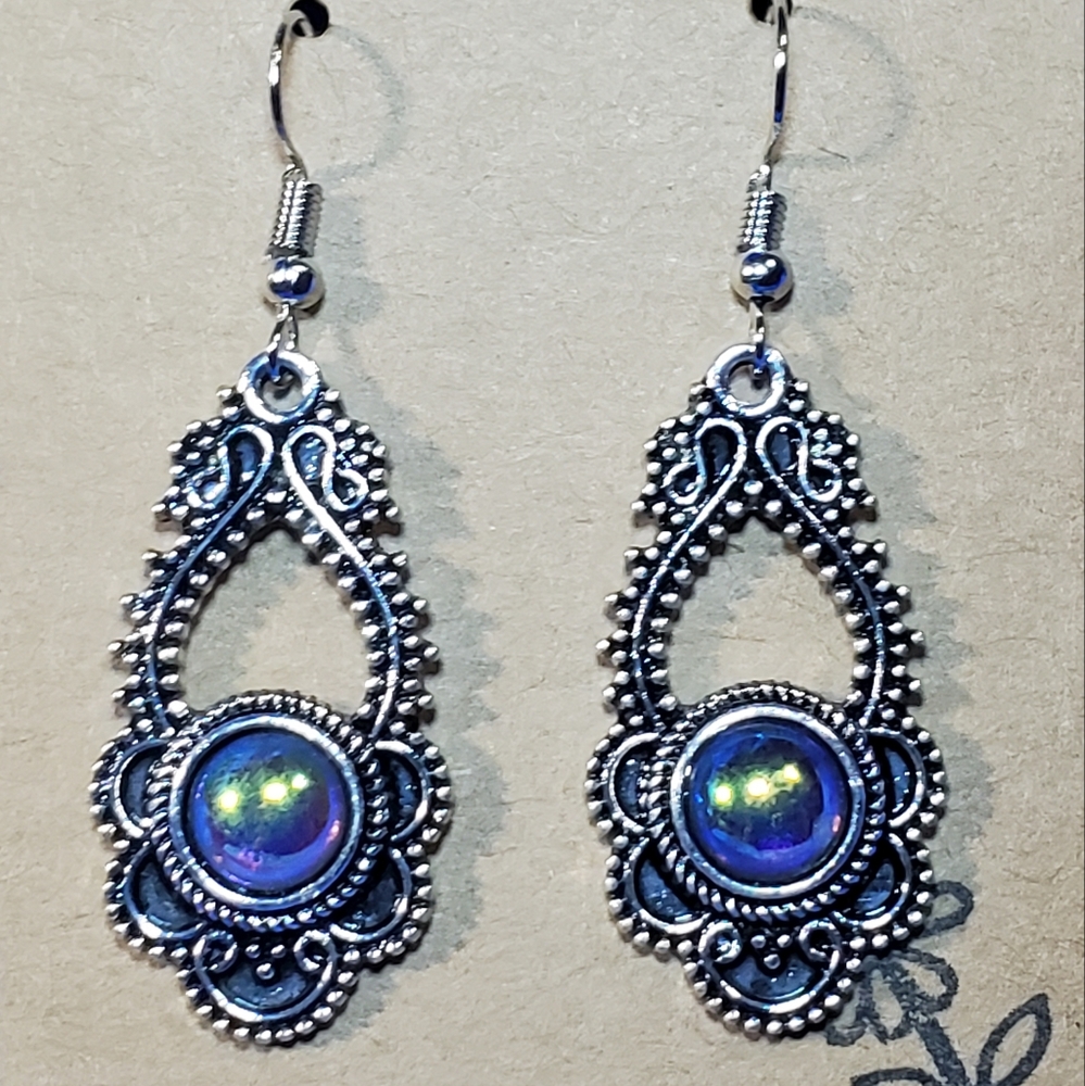 Ornate silver earrings with Dragon's Eyes